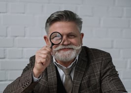 Old Man with Magnifying Glass